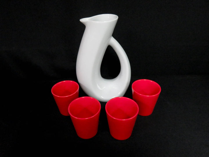 White Pitcher and Red Cups