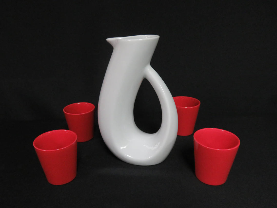 White Pitcher and Red Cups