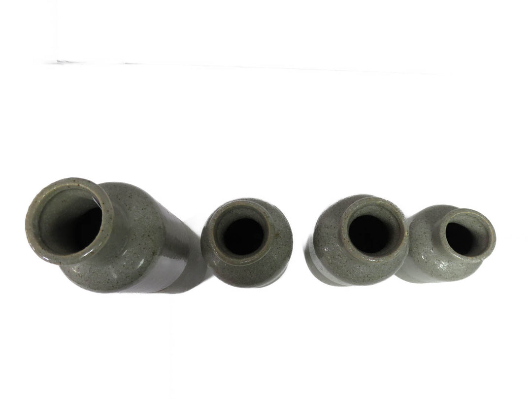 Four Grey Speckled Vases