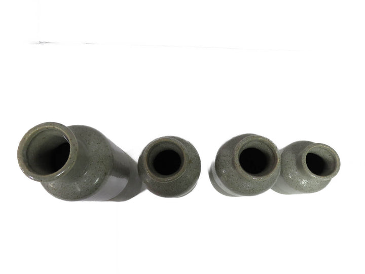 Four Grey Speckled Vases