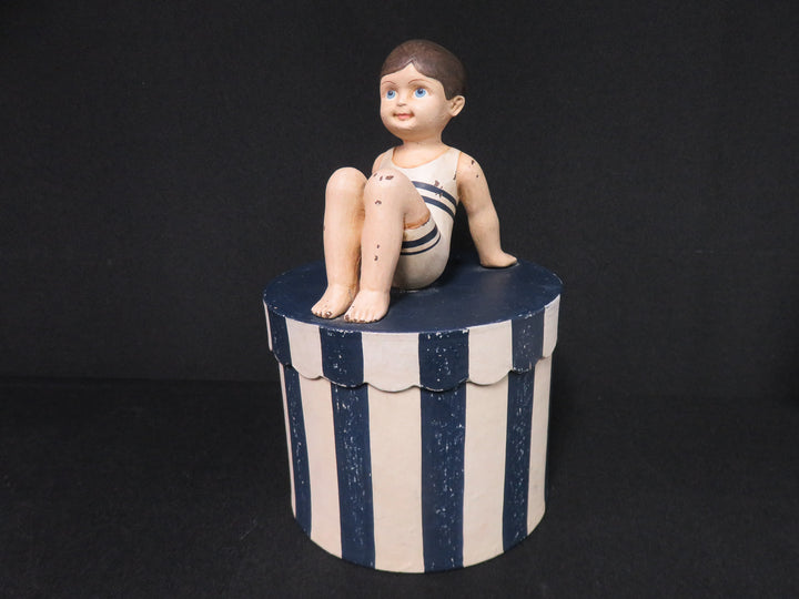 Boy on Striped Box