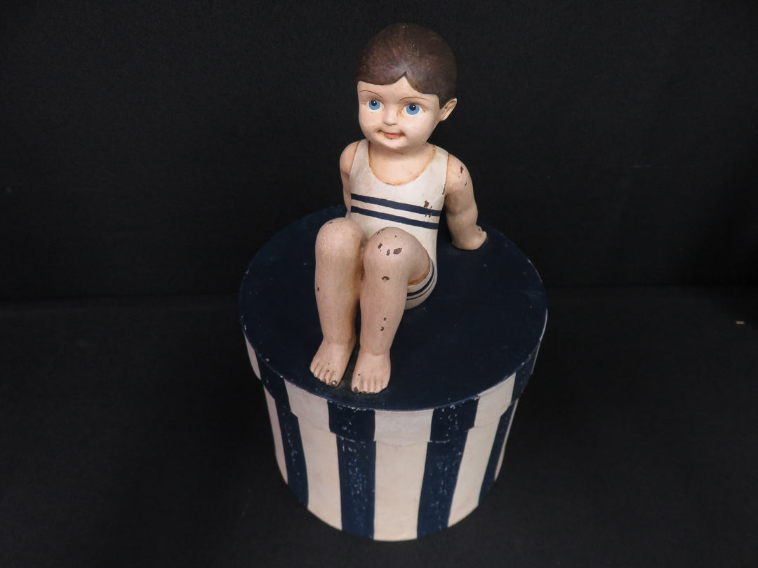 Boy on Striped Box
