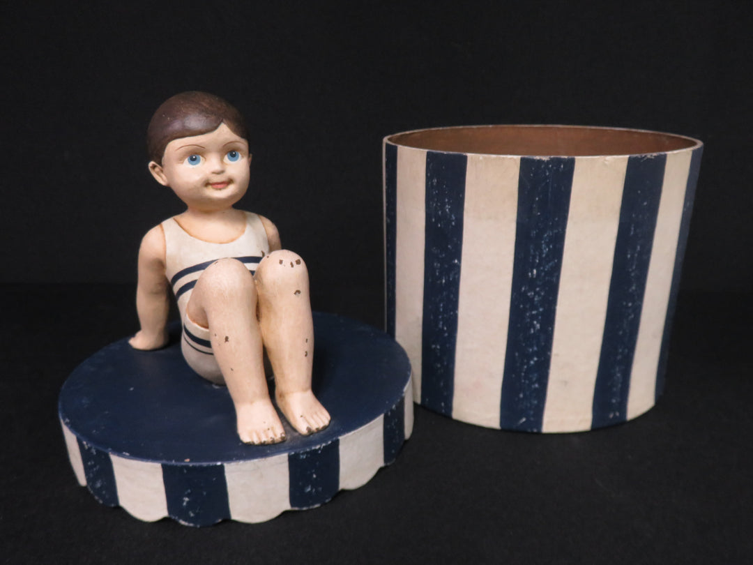 Boy on Striped Box