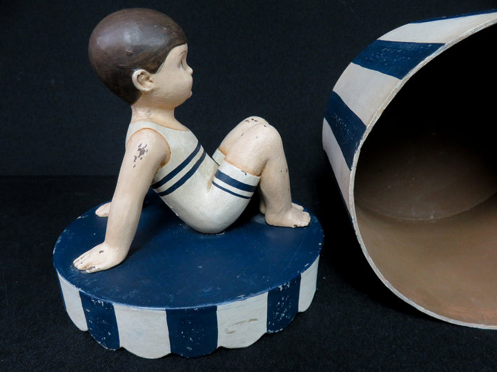 Boy on Striped Box