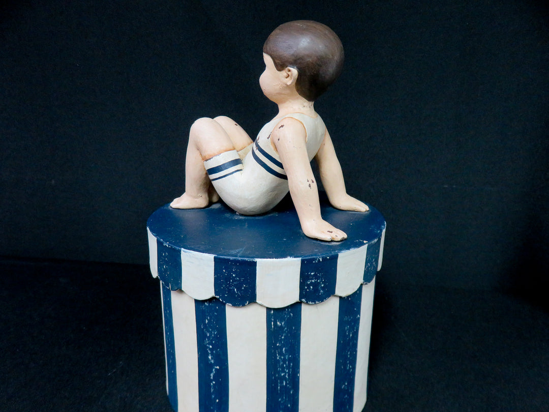 Boy on Striped Box