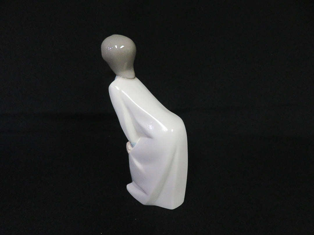 Lladró Kissing Girl Figurine