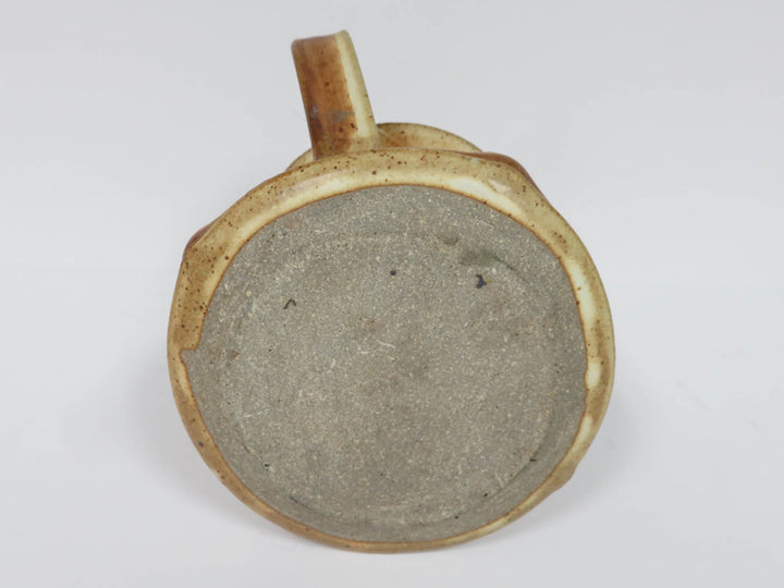 Sand Colored Pottery Pitcher