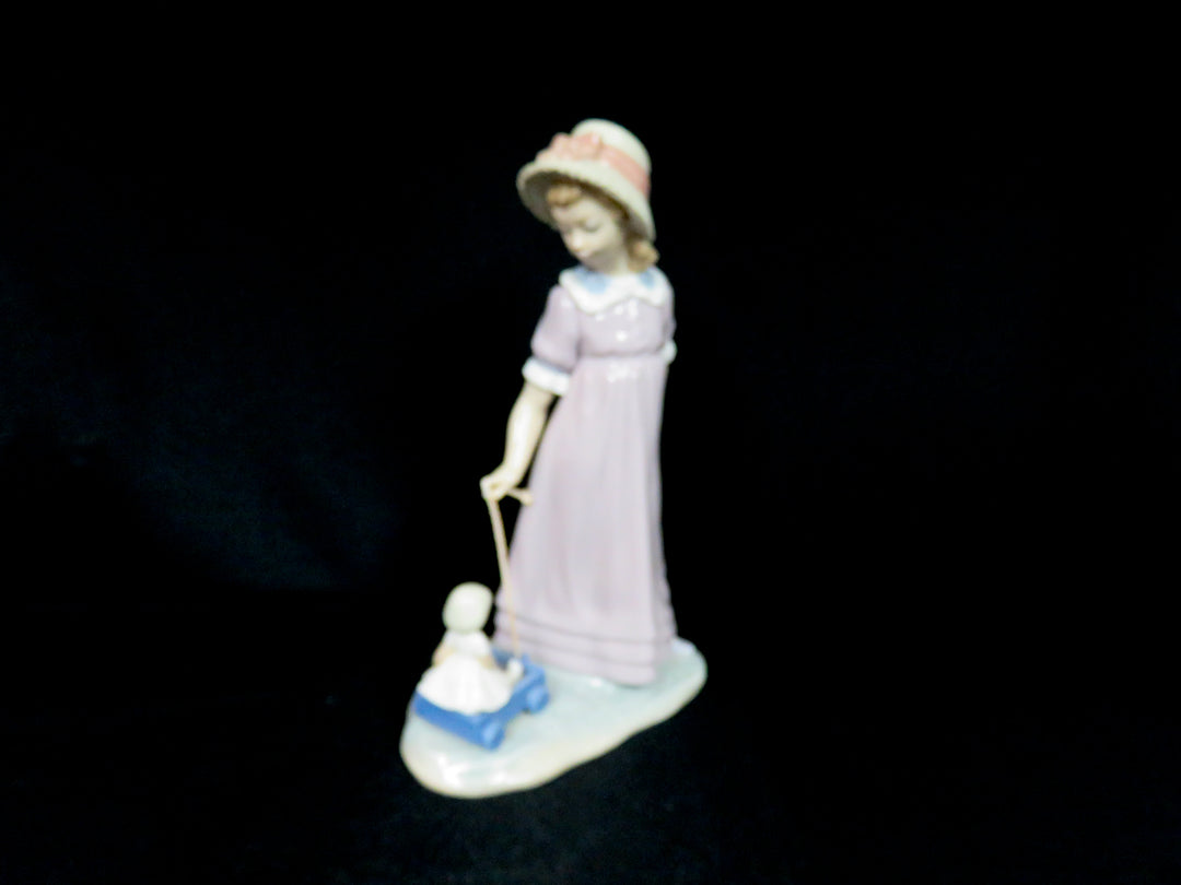 Lladró "Girl Pulling Toy Wagon"