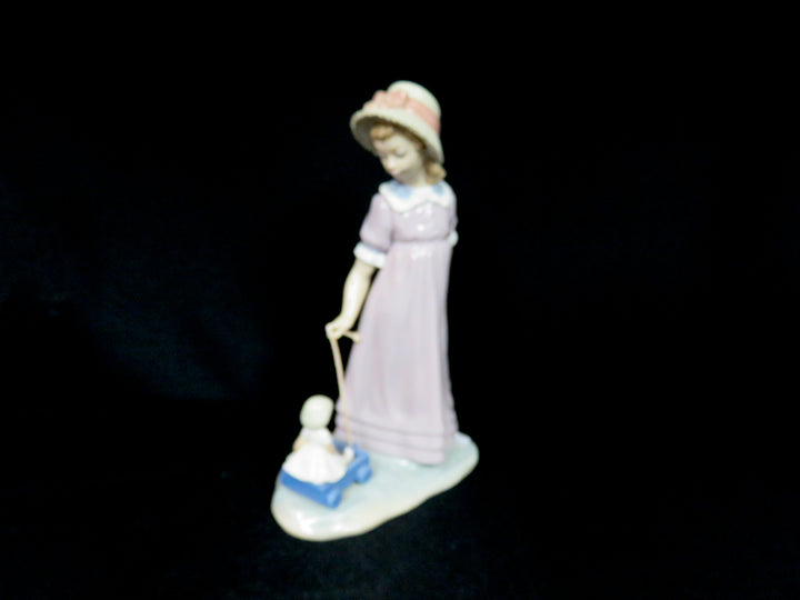 Lladró "Girl Pulling Toy Wagon"