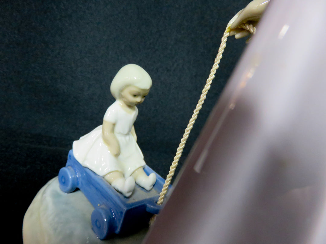 Lladró "Girl Pulling Toy Wagon"