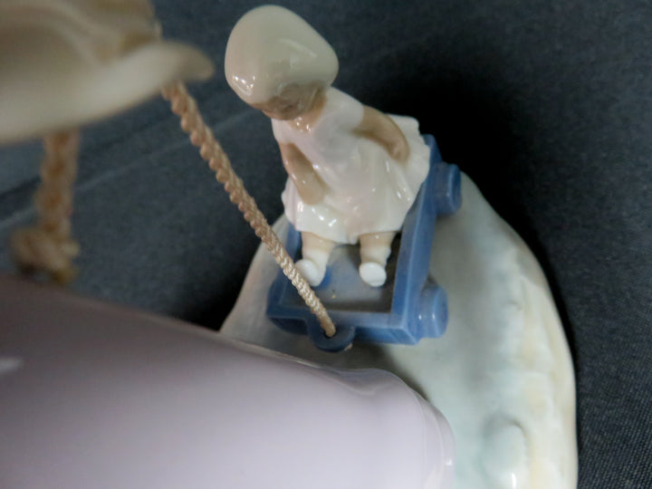 Lladró "Girl Pulling Toy Wagon"