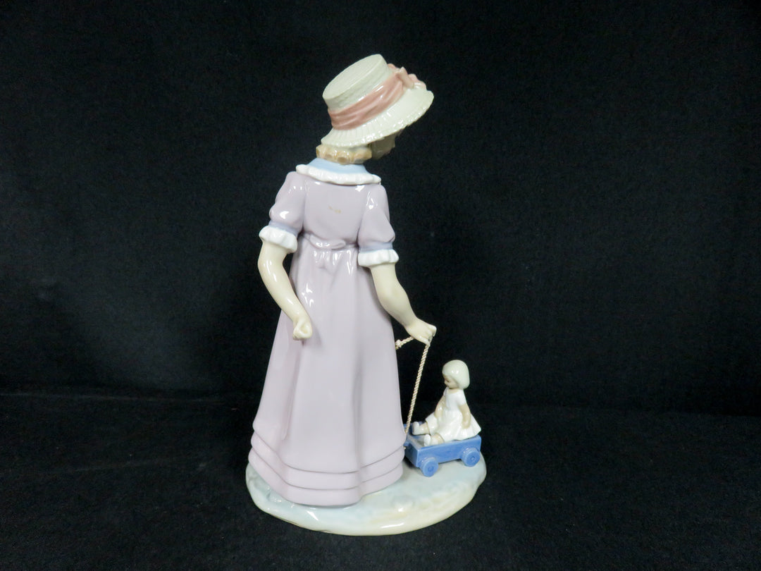 Lladró "Girl Pulling Toy Wagon"