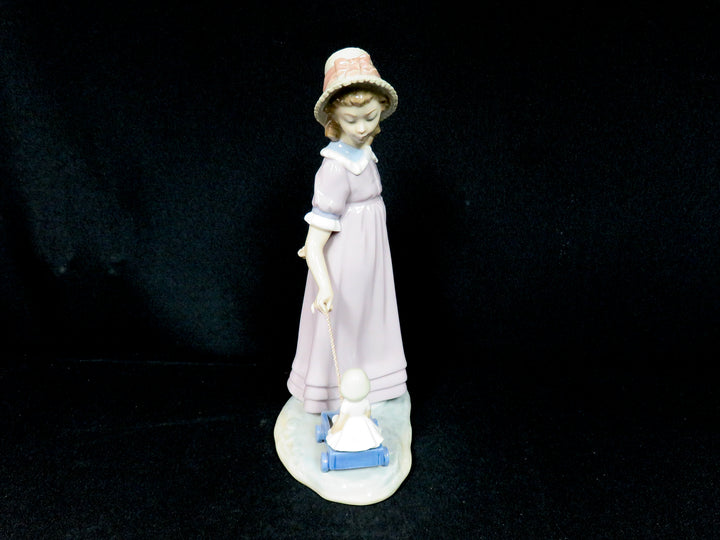 Lladró "Girl Pulling Toy Wagon"