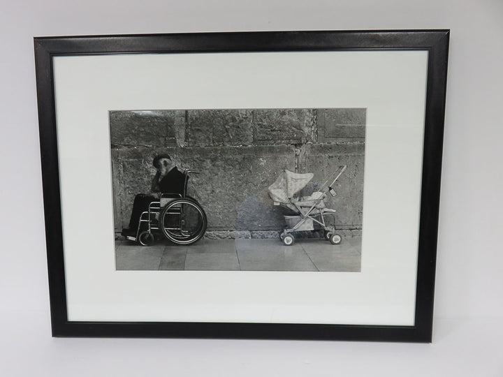Man in Wheelchair and Child Stroller Photograph