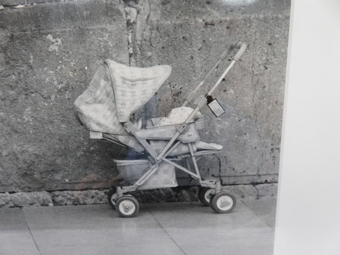 Man in Wheelchair and Child Stroller Photograph