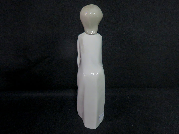 Lladró Girl Kissing Figurine