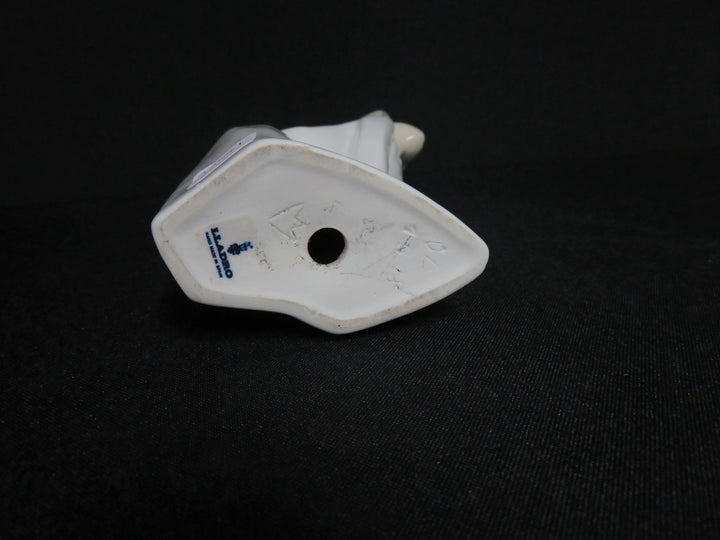 Lladró Girl Kissing Figurine