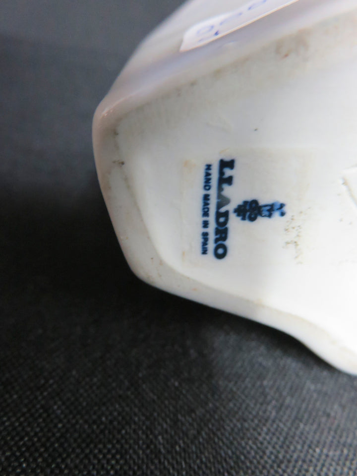 Lladró Girl Kissing Figurine